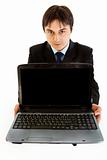 Smiling modern businessman holding laptops blank screen 
