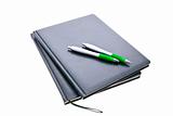 notepads and pens isolated