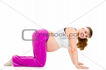 Smiling beautiful pregnant woman doing fitness exercises
