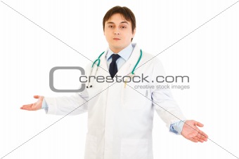 Young medical doctor with confusion expression on his face
