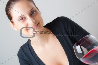 Beautiful young lady with a glass of wine