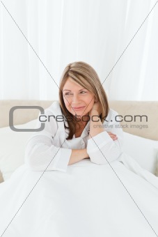 Portrait of a pretty woman on her bed