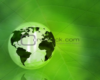 Globe on abstract leaf background