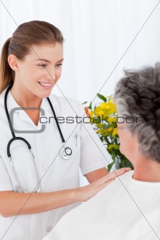 Mature woman talking with her nurse