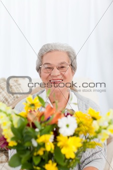 Senior woman with flowers 