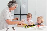 Children cooking with their grandmother