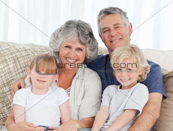 Joyful family looking at the camera 