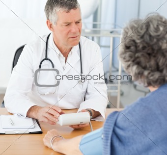 A senior doctor with his patient