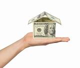 Hand and money house isolated on white background
