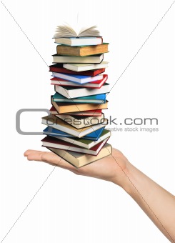 Books on hand isolated on white background