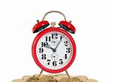 Alarm clock with golden coins on white background