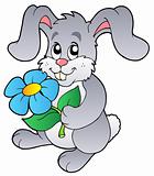 Cute bunny holding flower