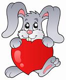 Cute bunny holding heart