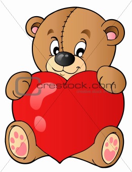 Cute teddy bear holding heart