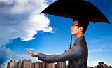 The insurance agent with umbrella and Weather Observation
