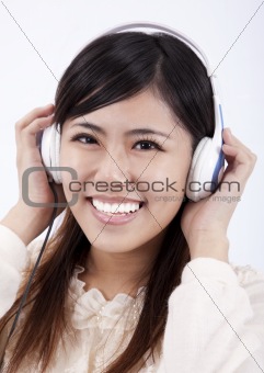 Happy Asian girl with headphone.Isolated with white background.