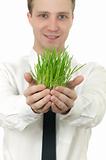 man holding a small plant