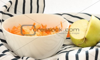 Grated  carrot and apple in a bowl