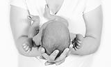 Newborn Baby taken closeup in mother's Hand 