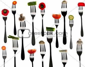 Many slice of vegetables in forks