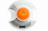 Orange fruit on food scale