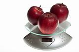 Red apples on food scale