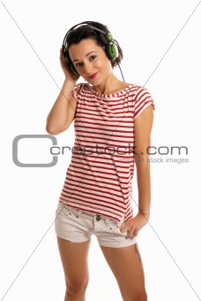 Young woman listening music with headphones standing on white background
