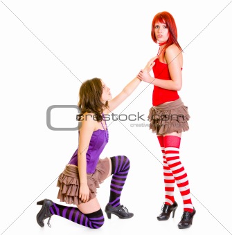 Cute girl on knees beging her girlfriend
