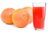 Grapefruits and glass of juice.