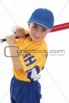 Smiling boy holding a baseball tball bat