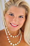 young beautiful woman with white healthy teeth and pearl