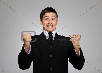 Expressions - Young handsome business man screaming of joy