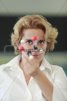 Female researcher analyzing a molecular structure