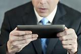 Businessman Concerned By Tablet