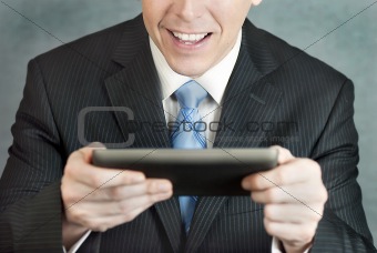Businessman Excited By Tablet