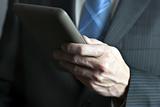 Businessman Holds Tablet Computer