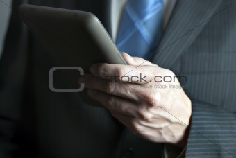 Businessman Holds Tablet Computer