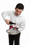 Waiter or servant pouring wine