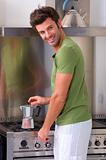 man in the kitchen preparing coffee