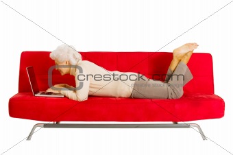 elderly woman on the couch with laptop