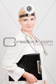 young female doctor or nurse making notes