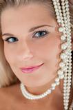 pretty woman face with pearl necklace