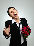 Expressions. screaming husband holding rose flower