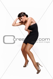 Beautiful sexy woman with slim body in short elegant dress .