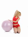 Beautiful fitness woman doing exercise with pilates ball.