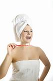 Young beautiful woman with healthy strong teeth and white towel 