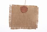 Wax seal on sackcloth material 