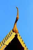 detail of ornately decorated temple roof in bangkok, thailand 

