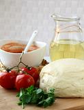 dough, tomato sauce, olive oil and tomato