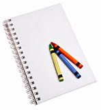 Crayons on a Blank Notepad